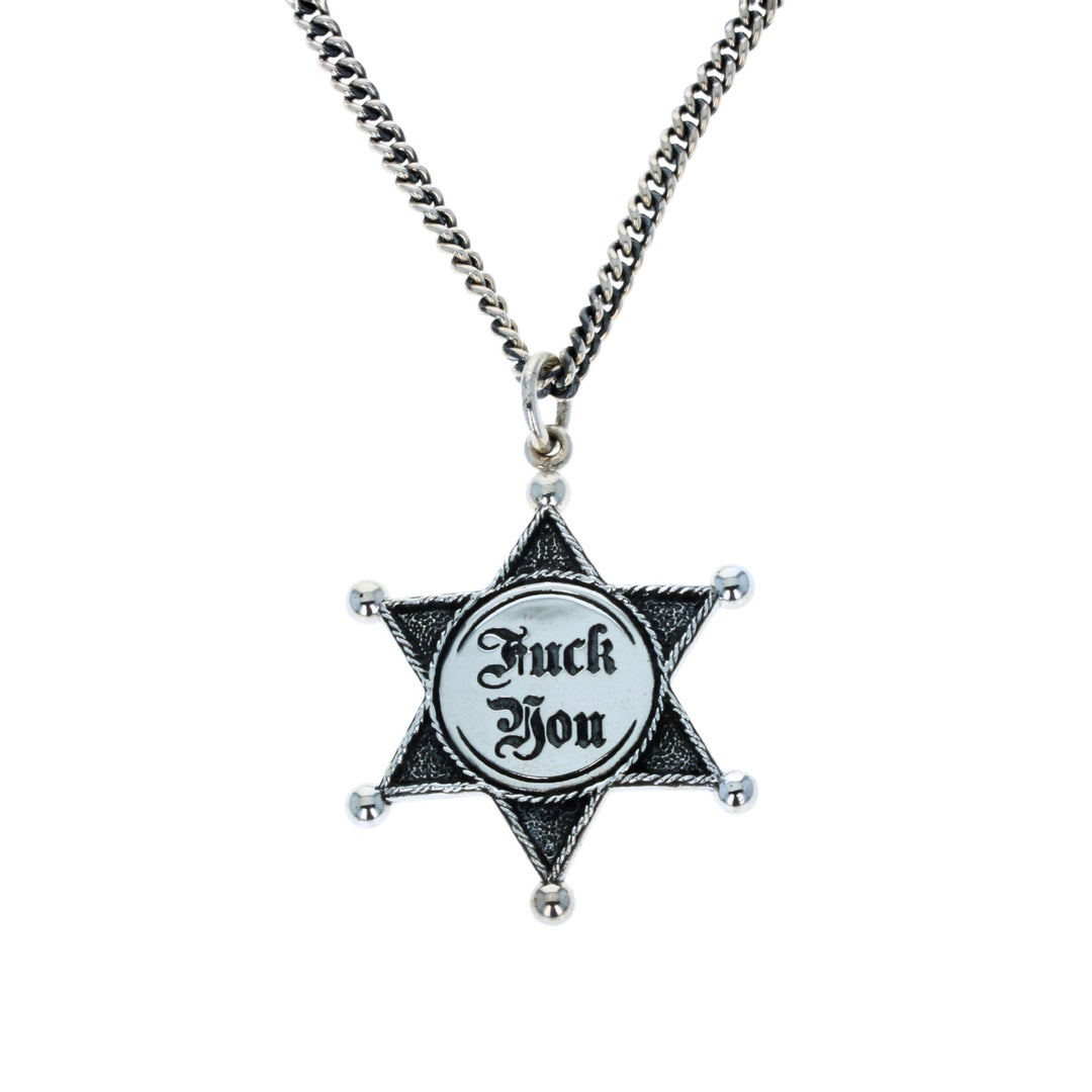 Star-shaped pendant with 'F**k You' text on a chain against a white background