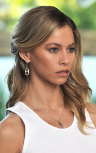 woman wearing king baby sterling silver earrings with 18k gold