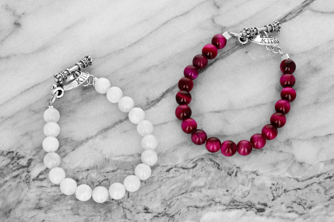 Lifestyle shot of pink tiger eye and white moonstone bracelet