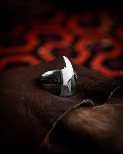 Style shot of wrapped axe ring on leather hide