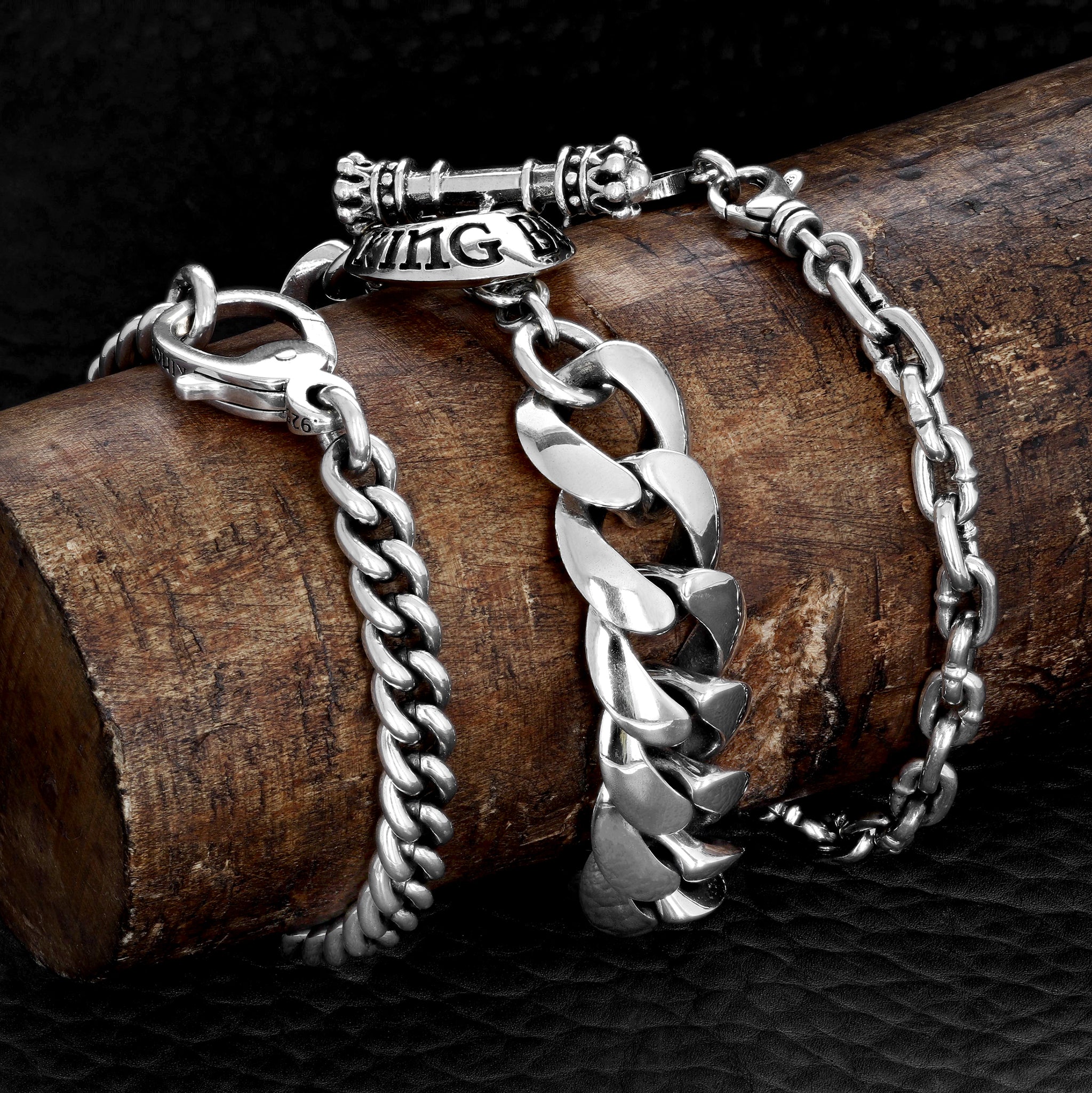 Product shot of three bracelets on a wood mandril