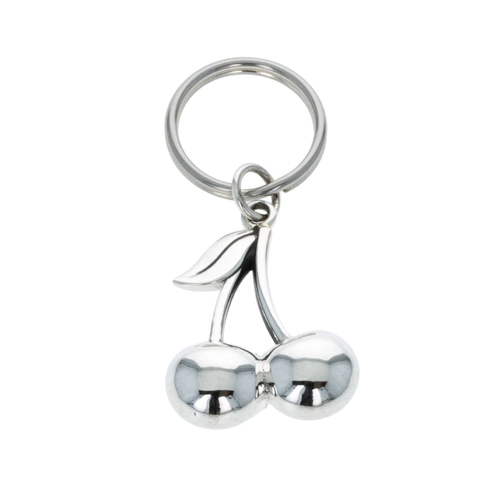 Silver cherry-shaped keychain on a white background
