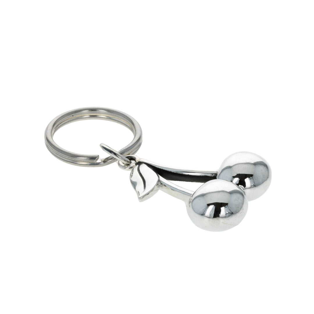 Silver keychain shaped like a cherries on a white background