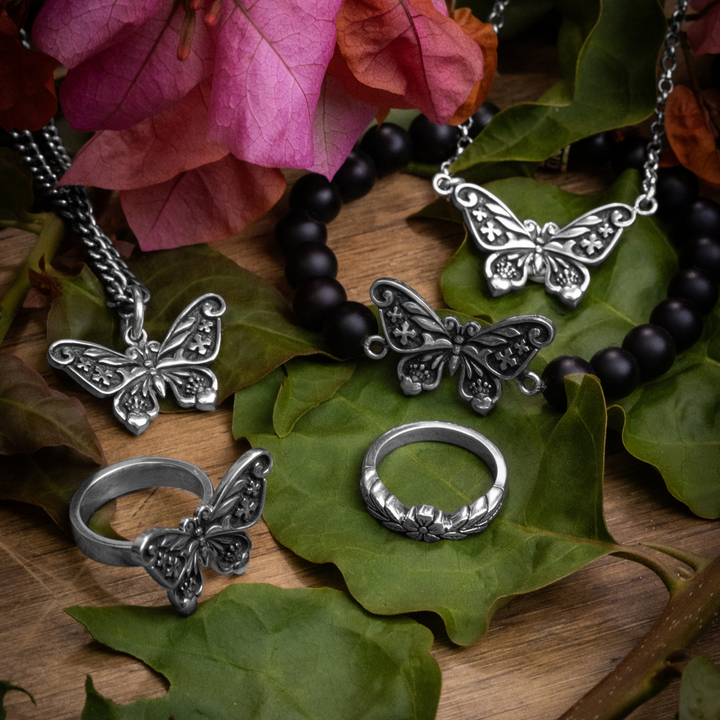 Butterfly Pendant, Necklace, Bracelet Ring and Flower Ring on leaves and flowers