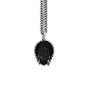 Product shot of back of skull pendant with feather headress on
