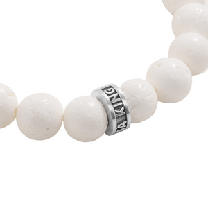 10mm White Coral Beaded Bracelet w/ Logo Ring close up on logo ring