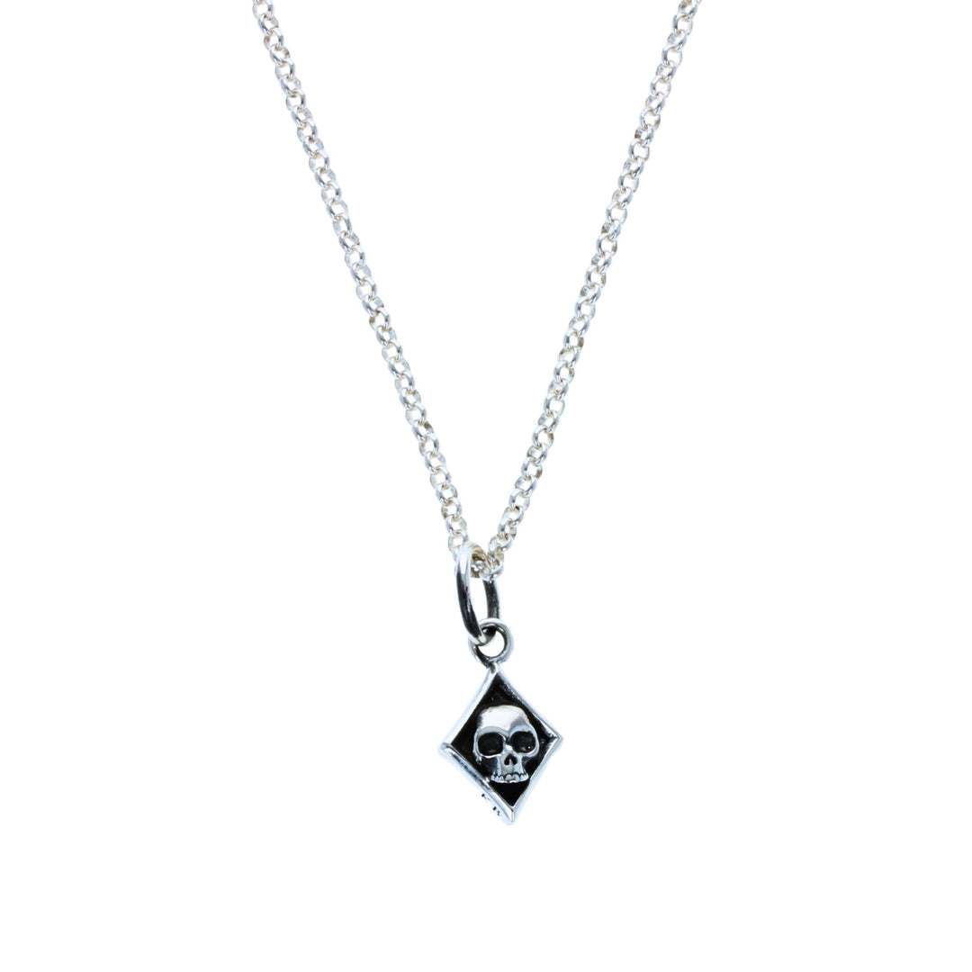 Diamond skull card suit pendant on white background