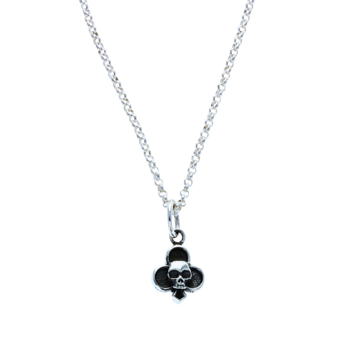 Club skull suit pendant on black background