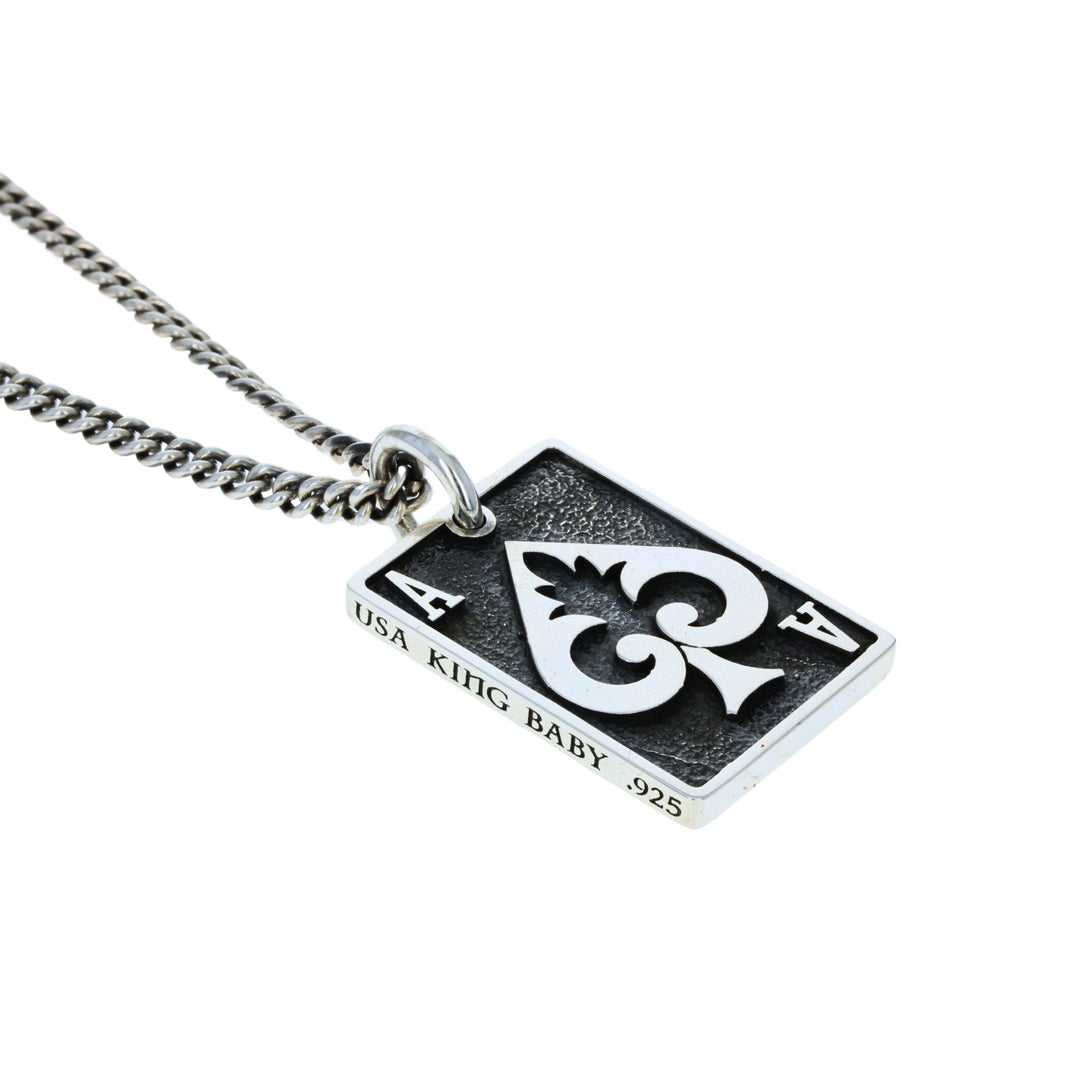 Ace Spade card pendant on white background