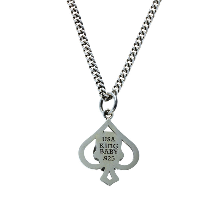 Cut out spade pendant on white background back view