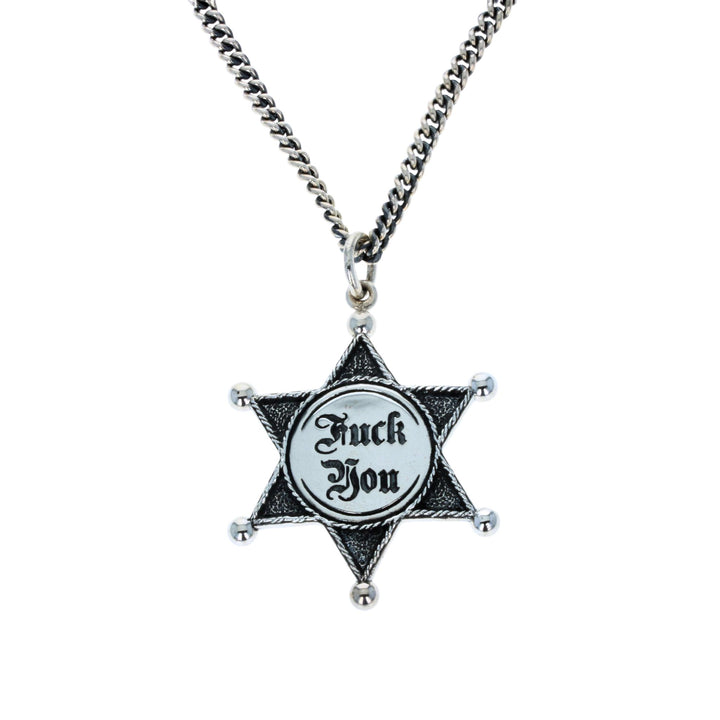 Star-shaped pendant with 'F**k You' text on a chain against a white background