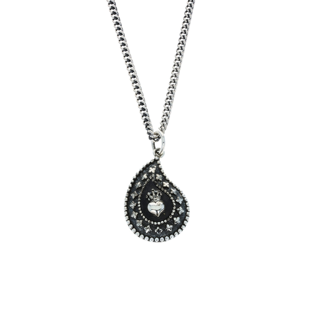 Teardrop-shaped pendant necklace with intricate design on a white background