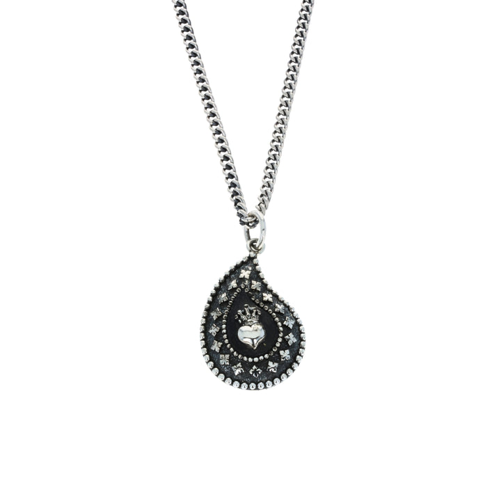 Teardrop-shaped pendant necklace with intricate design on a white background