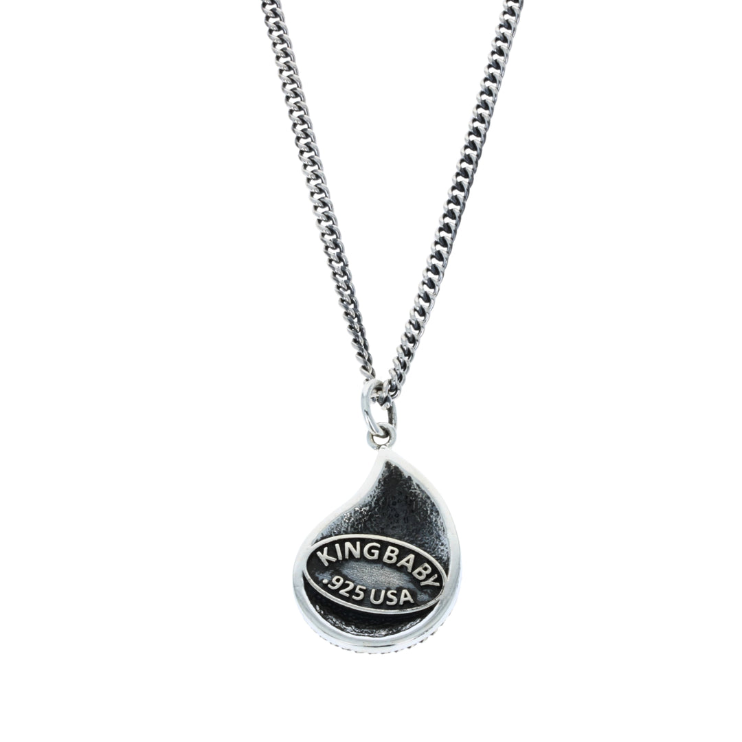 Silver necklace with a teardrop-shaped pendant on a white background