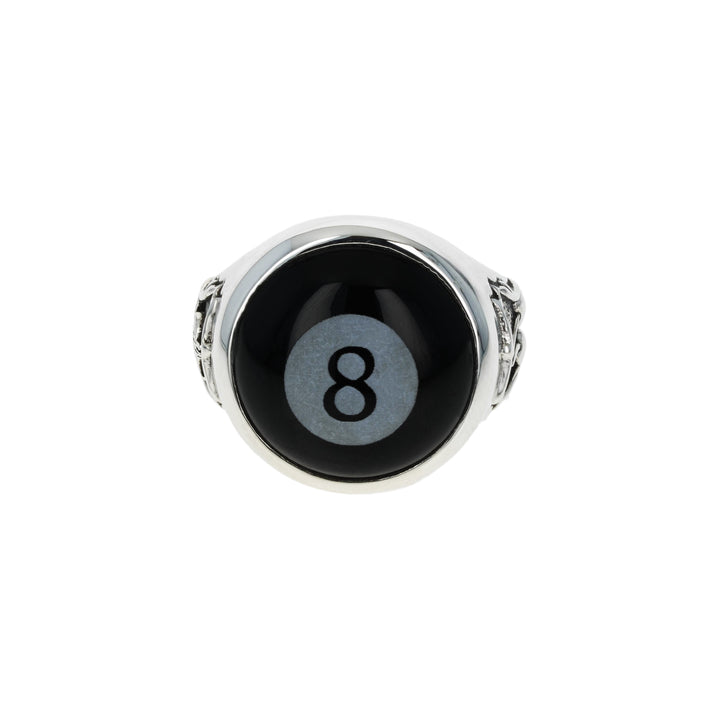 Black eightball with silver rim on a white background