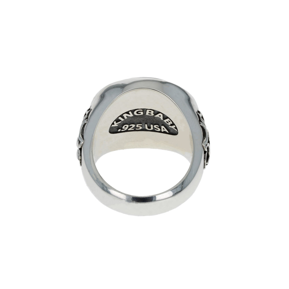 Silver ring with 'King Baby' engraving on a white background