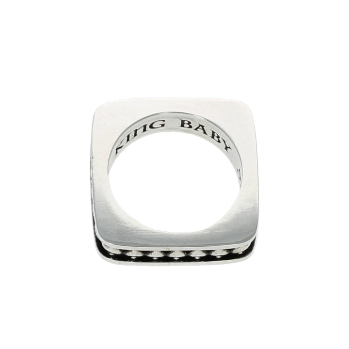 Silver Spade ring with 'KING BABY' engraving on a white background top