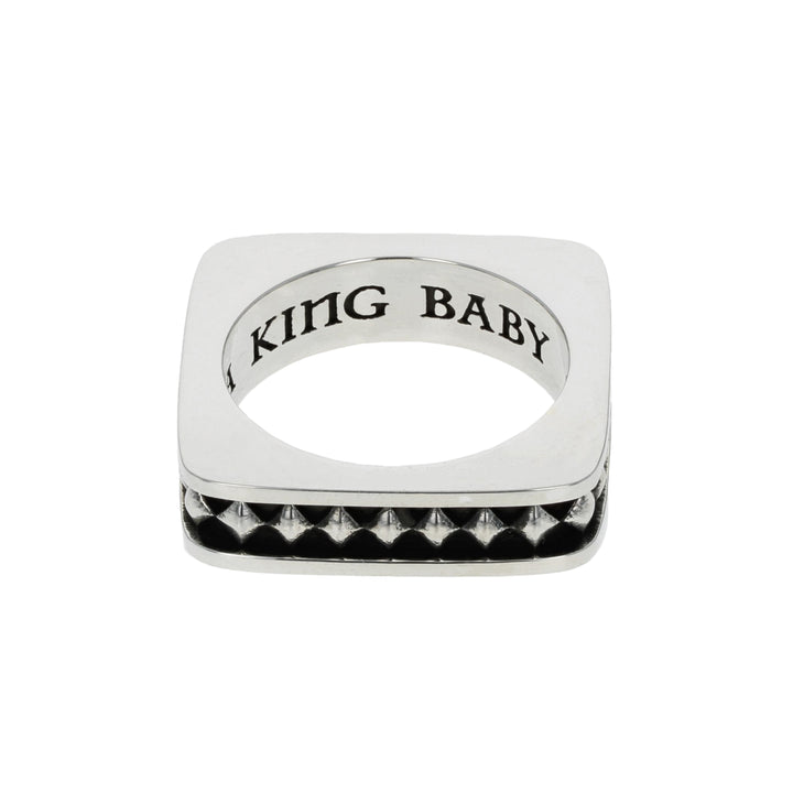 Silver diamond ring with 'KING BABY' engraving on a white background