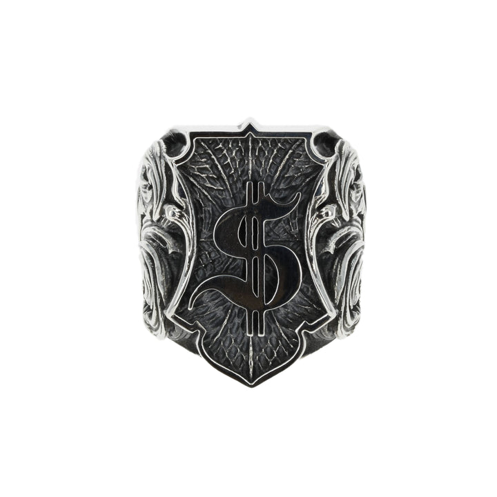 Silver ring with intricate dollar symbol design on a white background front view