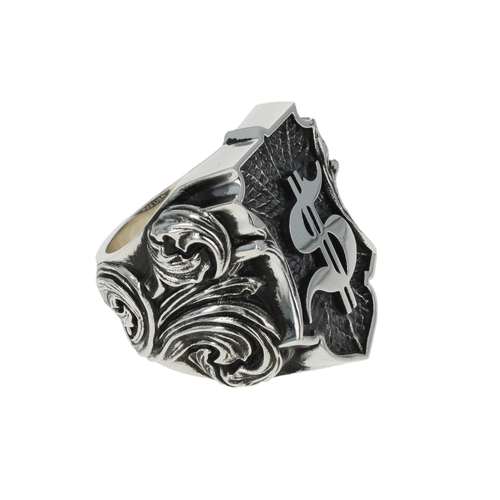 Silver ring with intricate dollar symbol design on a white background other side