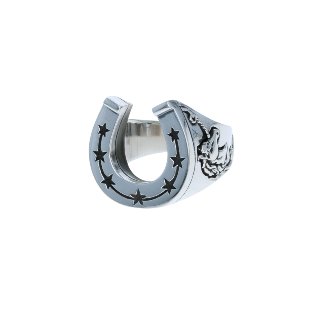 Silver horseshoe-shaped ring with star designs on a white background