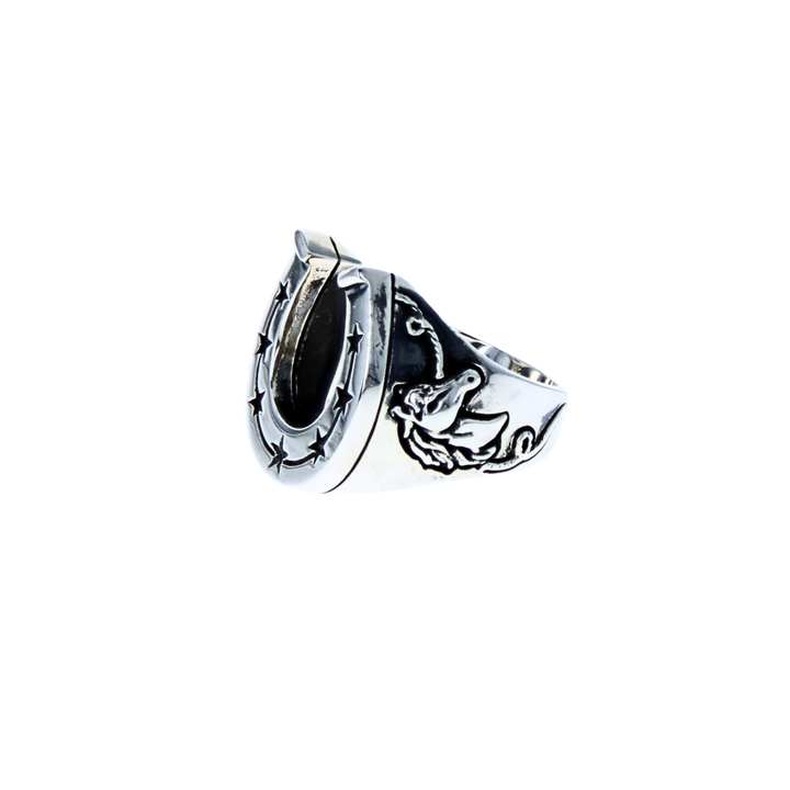 Silver horseshoe shaped ring with star design and horses on a white 