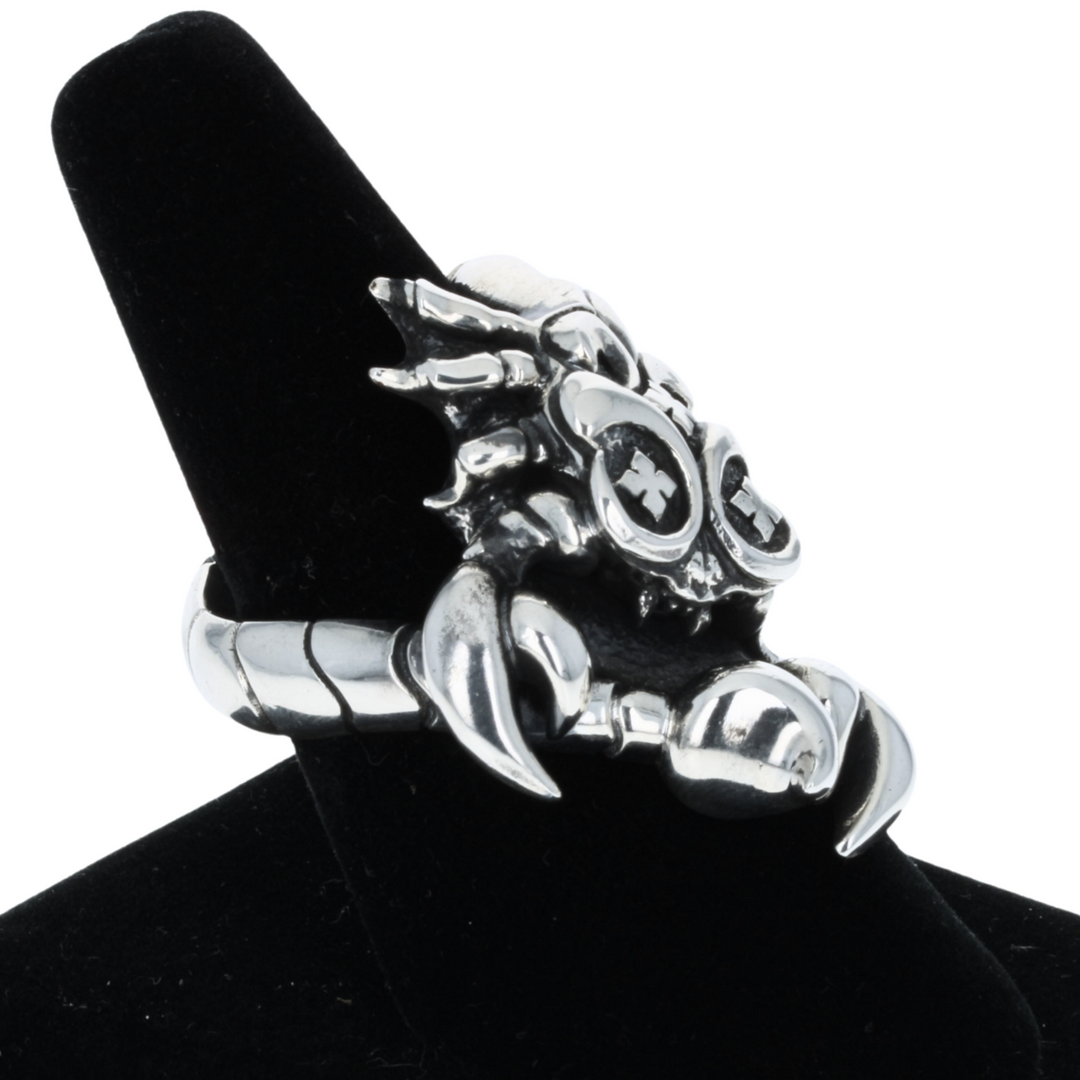 Scorpion Ring on white background 3/4 view on black finger display