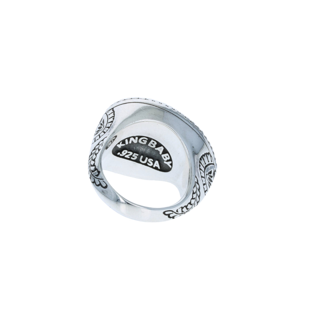 Silver ring with 'KING BABY' engraving on a white background