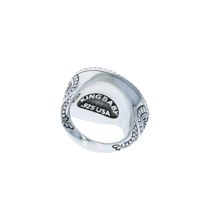Silver ring with 'KING BABY' engraving on a white background