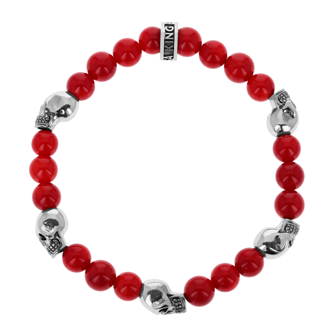 8mm Red Coral Bead Bracelet w/ 5 small silver skull beads on white background
