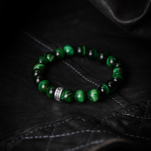 10mm Green Tiger Eye Beaded Bracelet w/ Logo Ring on black leather background