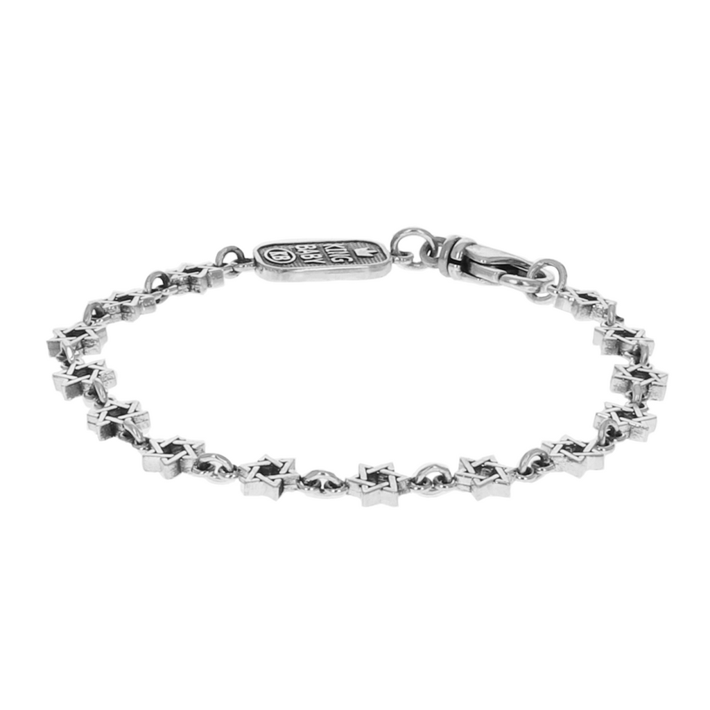 Silver star of david motif bracelet on white background