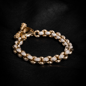 Closed bracelet shot of 10k Gold Large Infinity Link Bracelet w/ Pave Diamonds on black background