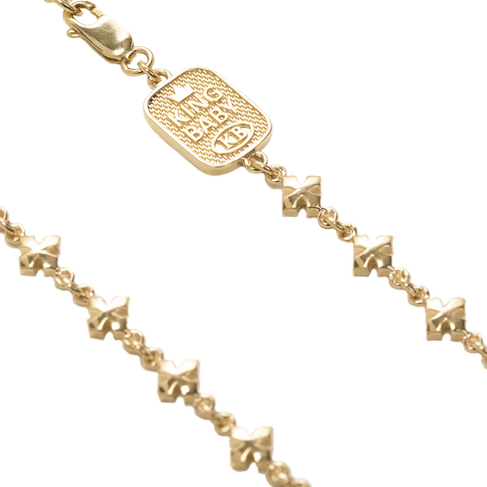 Close up of 10K YELLOW GOLD Small MB Cross Chain Necklace