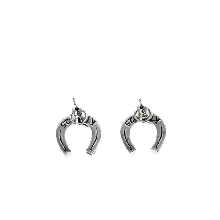 Silver horseshoe-shaped earrings on a white background