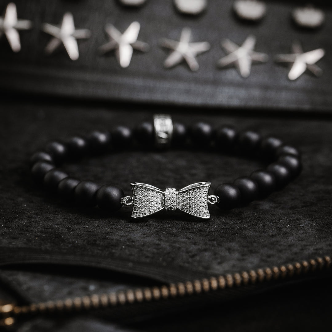 Lifestyle shot 8mm Onyx Bead Bracelet w/ Silver CZ Bow