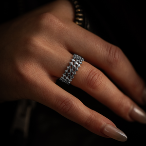 3 micro stackable mb cross silver ring on hand