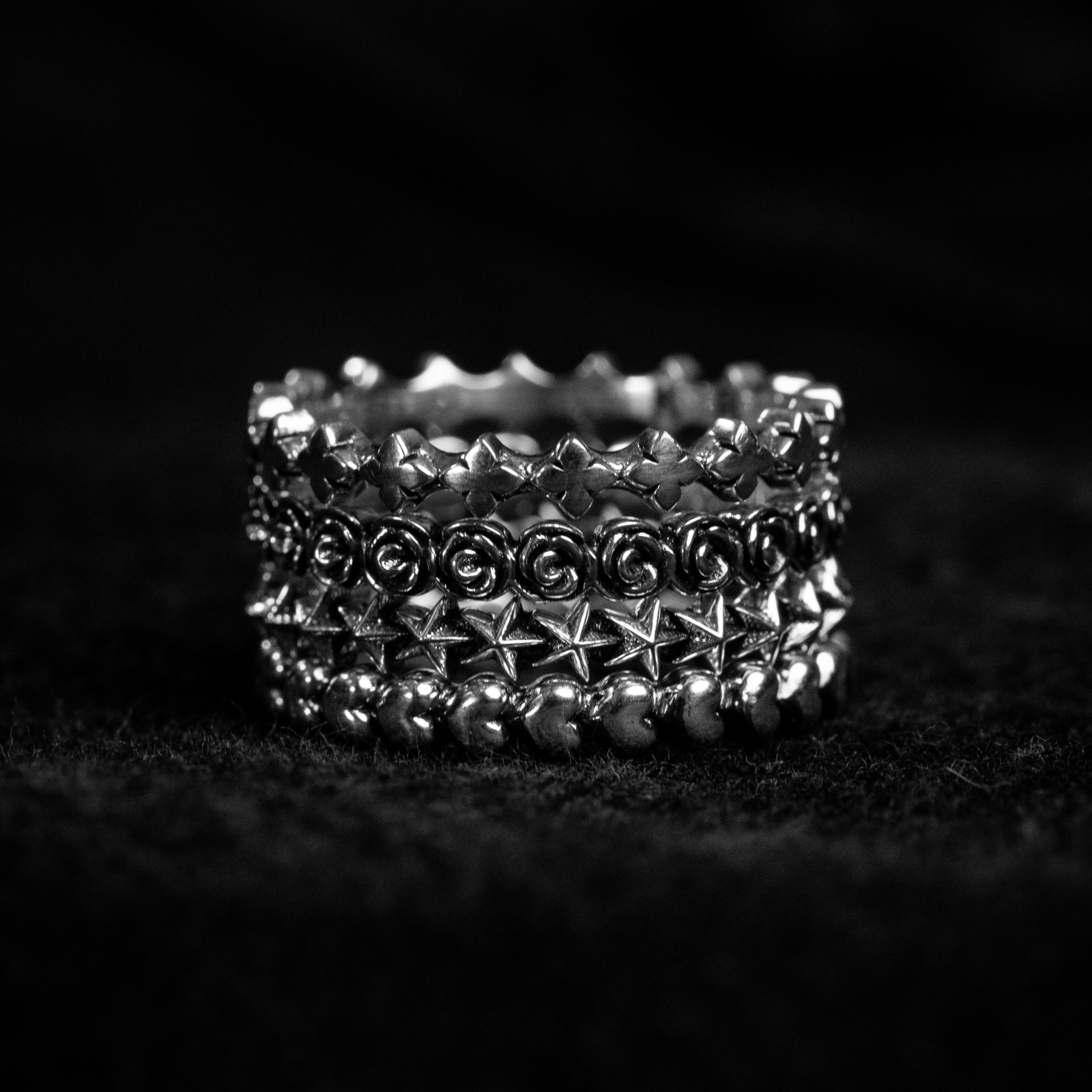 Super Micro Rose, Heart, MB Cross, & Star Stackable Rings Stacked on Top of Each Other