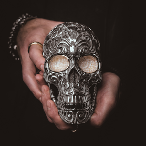 Hands holding New Silver Skull Sculpture with Pave Diamond Eyes