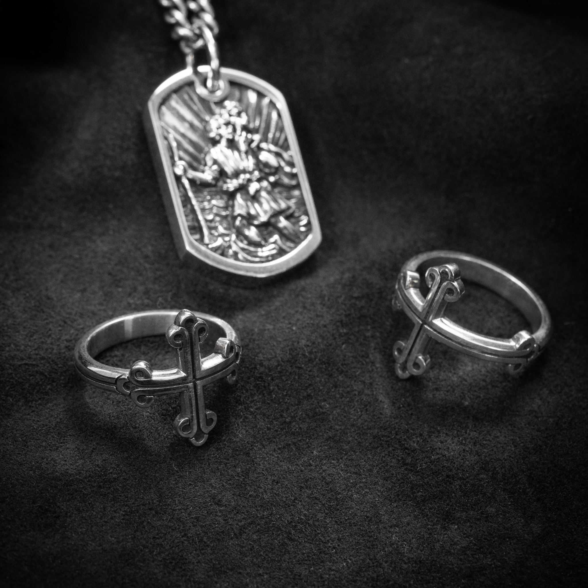 Lifestyle shot of 2 cross rings and dog tag