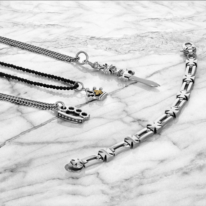 sterling silver jewelry. Pendants and link bracelet on marble