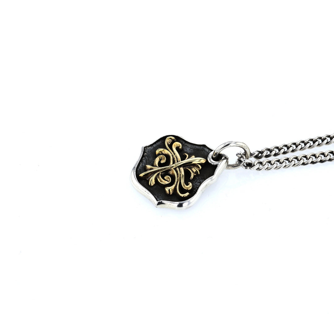 king baby silver and gold shield pendant