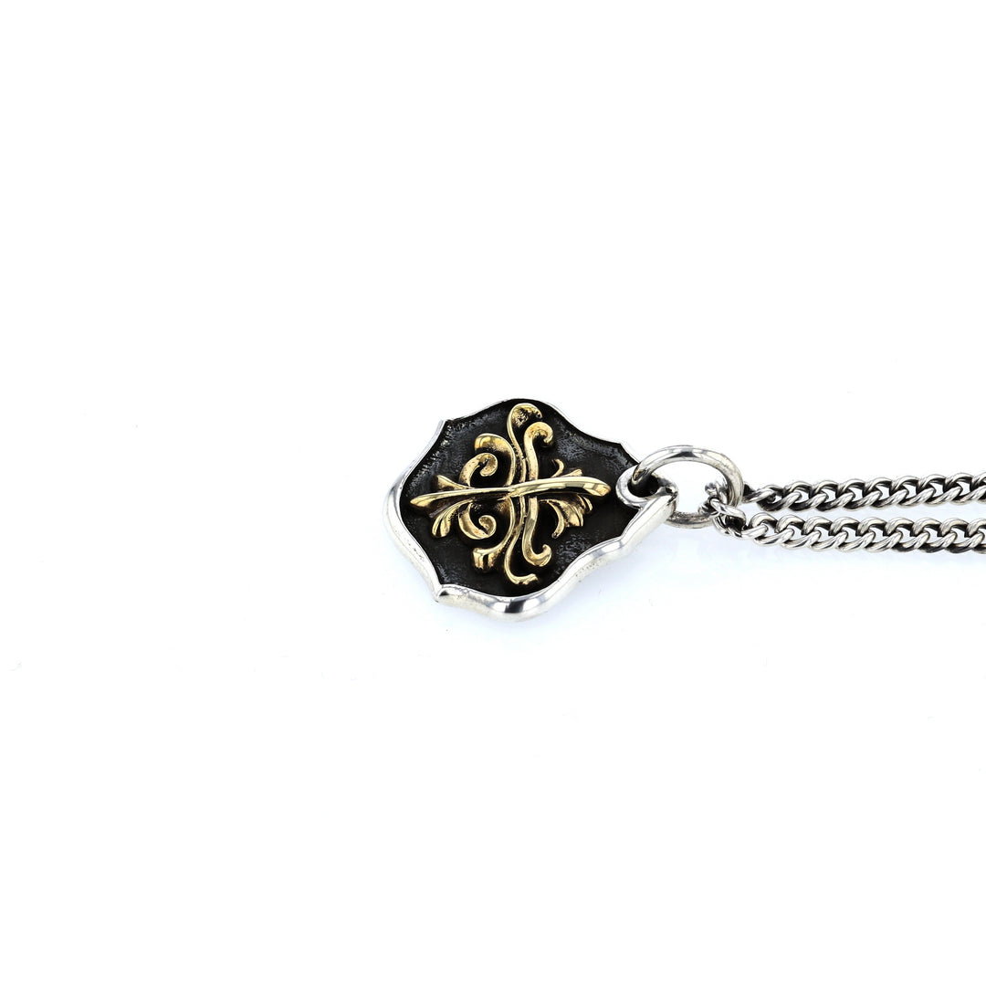 king baby silver and gold shield pendant