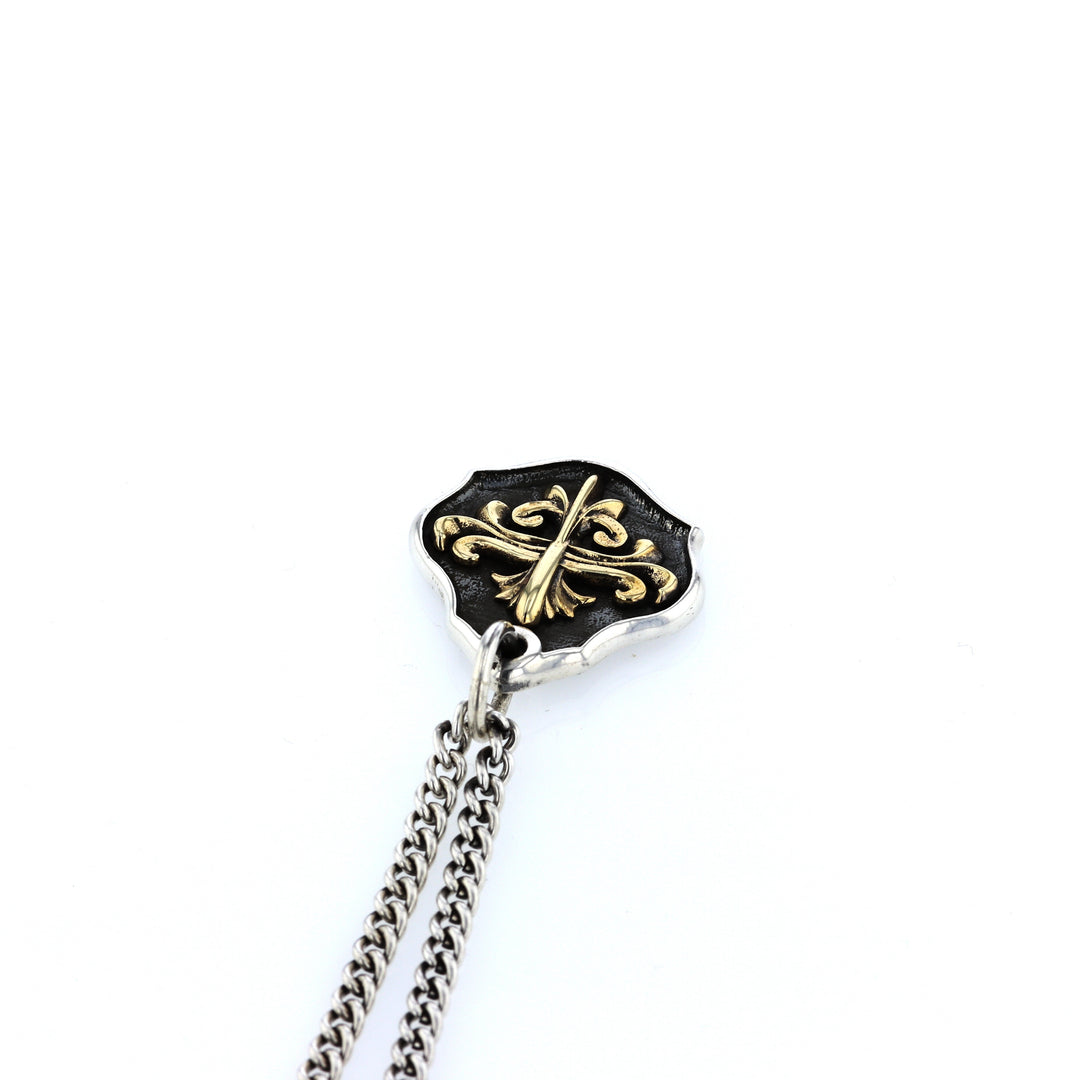 king baby silver and gold shield pendant