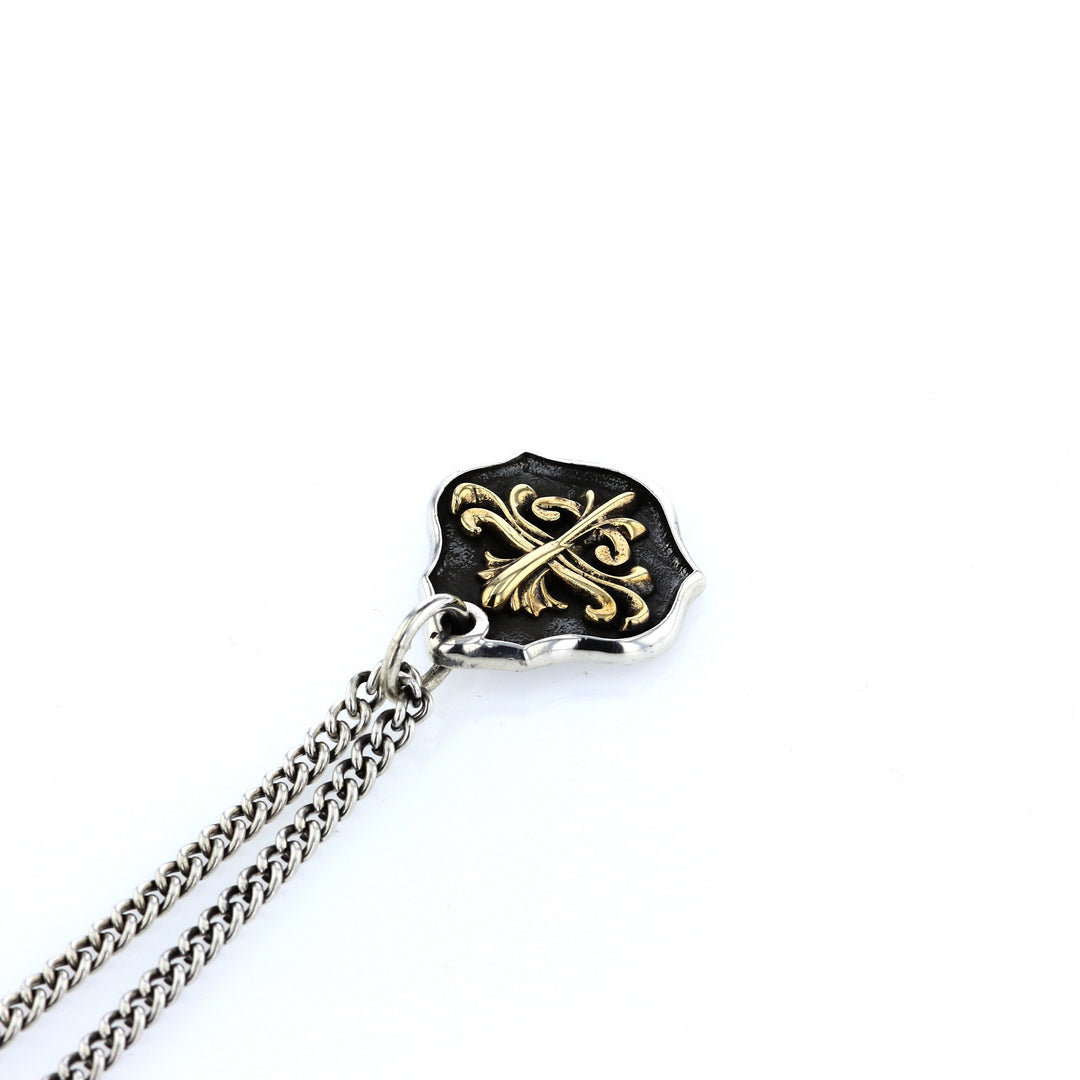 king baby silver and gold shield pendant