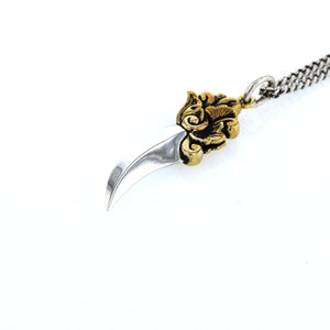 king baby silver and gold dagger pendant