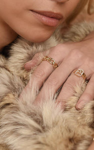 woman wearing 18k gold ring