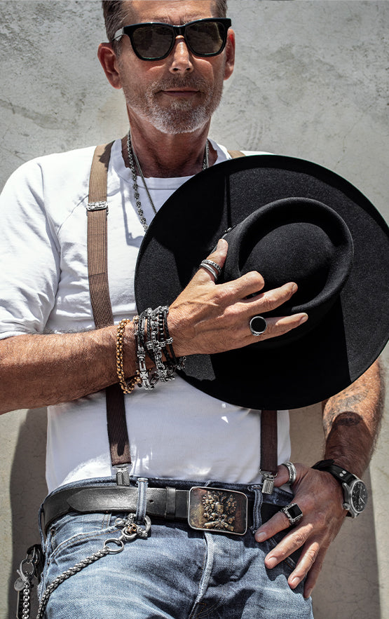 Model shot of Mitchell Binder wearing assorted jewlery