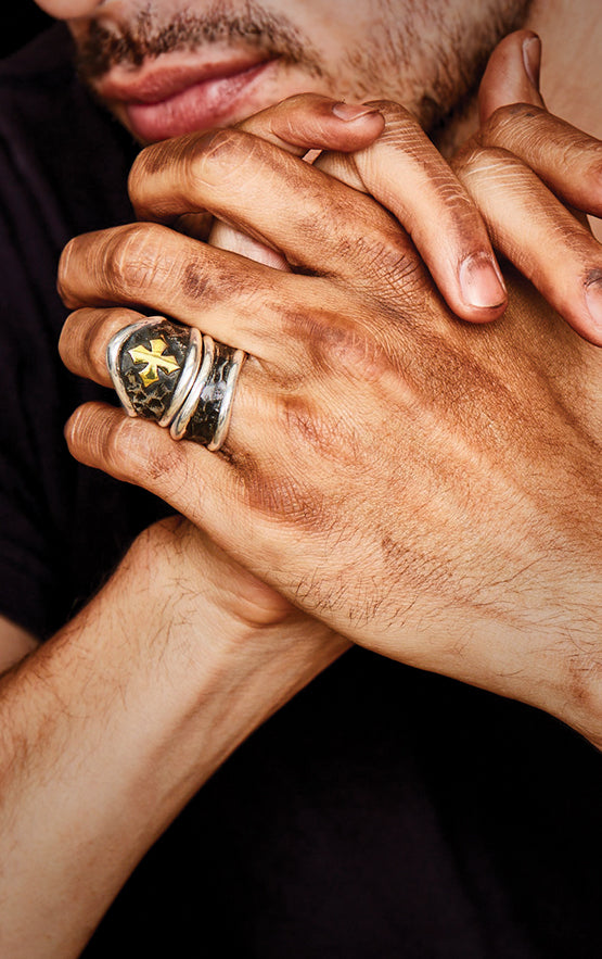 man wearing sterling silver king baby jewelry