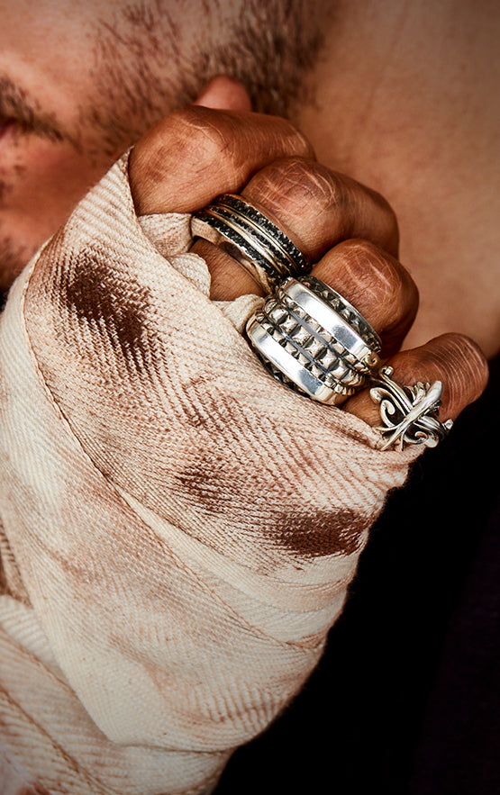 man wearing king baby sterling silver jewelry